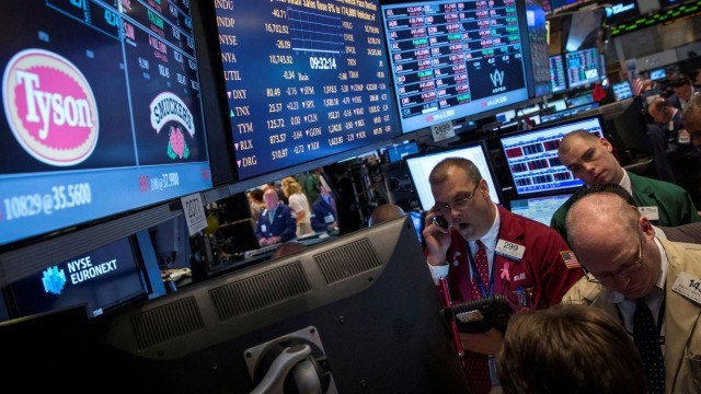 Dow claims record closing high, S&P 500 advances; chip selloff weighs on Nasdaq