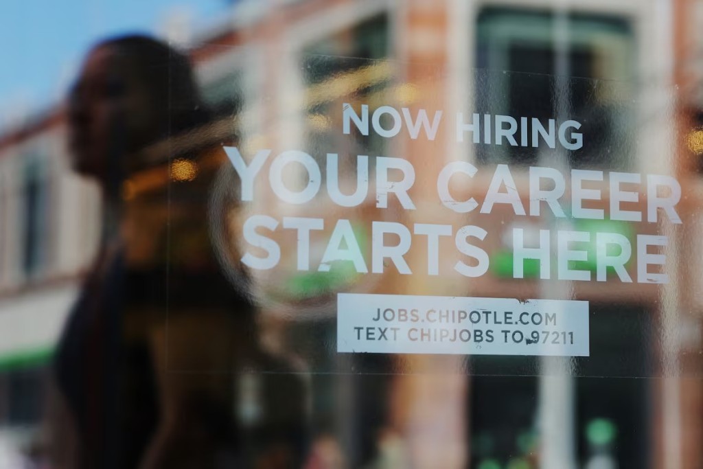 US jobless claims dip in latest week; goods trade deficit widens in July